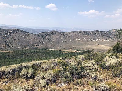 A scenic view of the hills and mountains above Reid Ranch.